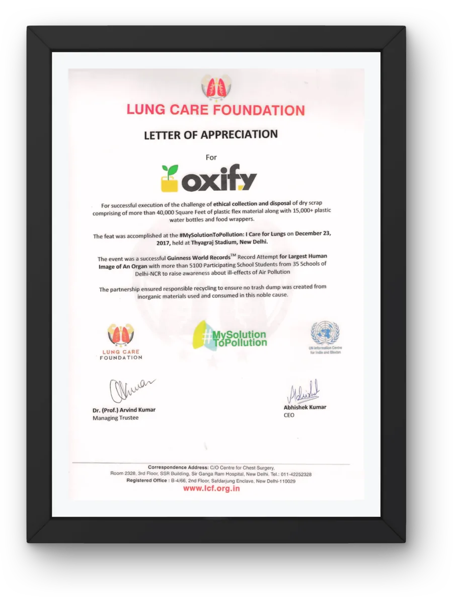 Framed Guinness World Records and Lung Care Foundation certificates of participation.